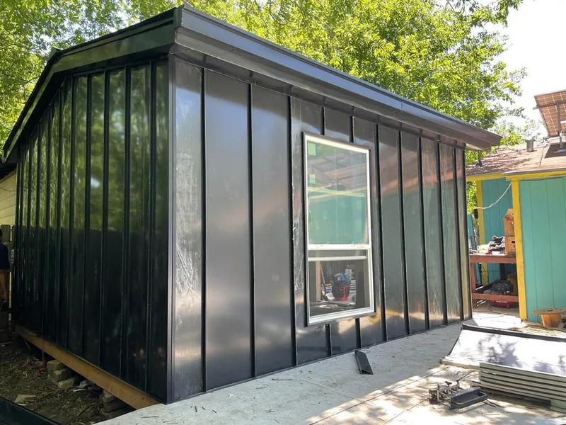 Black standing seam metal wall panels for Roof Inspection in Clarkdale